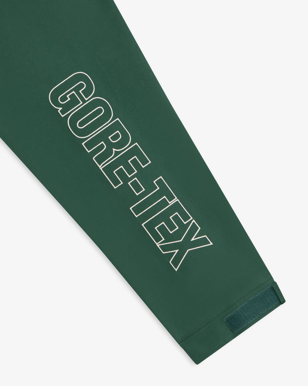 Dark green GORE-TEX Striped Sailing Jacket with bold white logo on sleeve and a small velcro-cuffed strap.