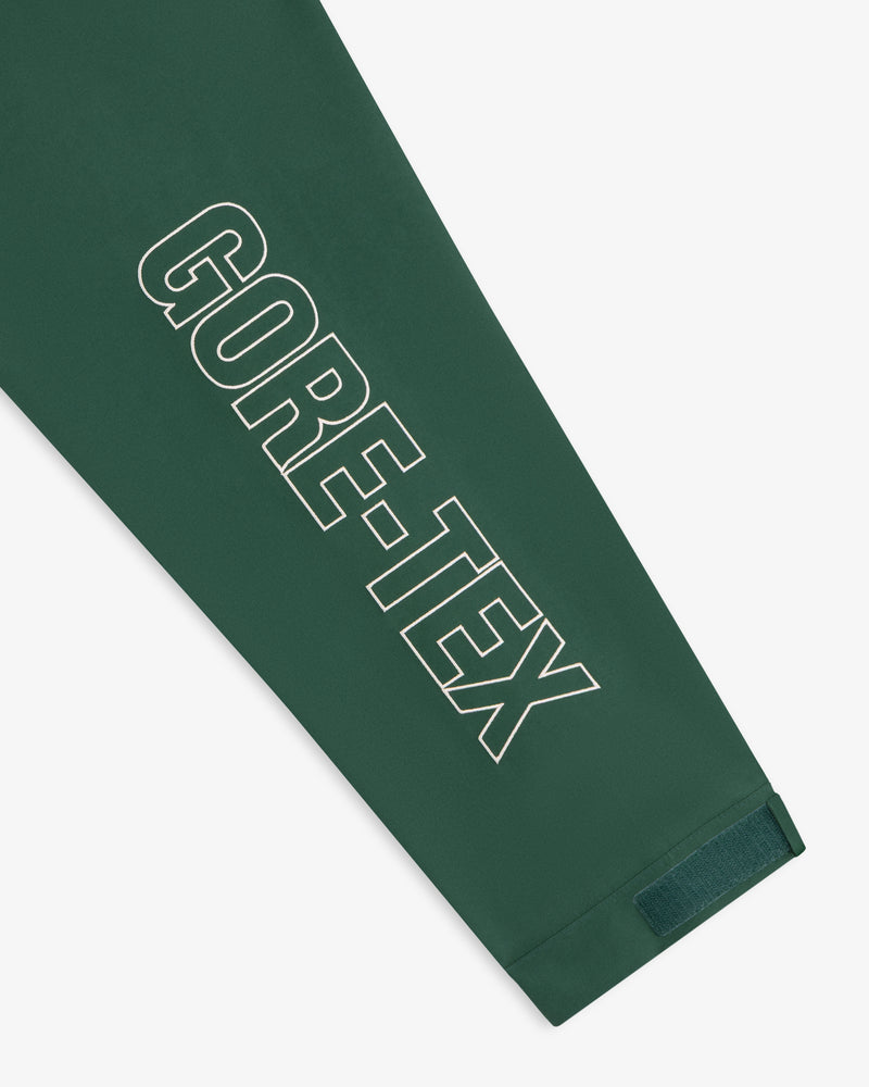 Dark green GORE-TEX Striped Sailing Jacket with bold white logo on sleeve and a small velcro-cuffed strap.