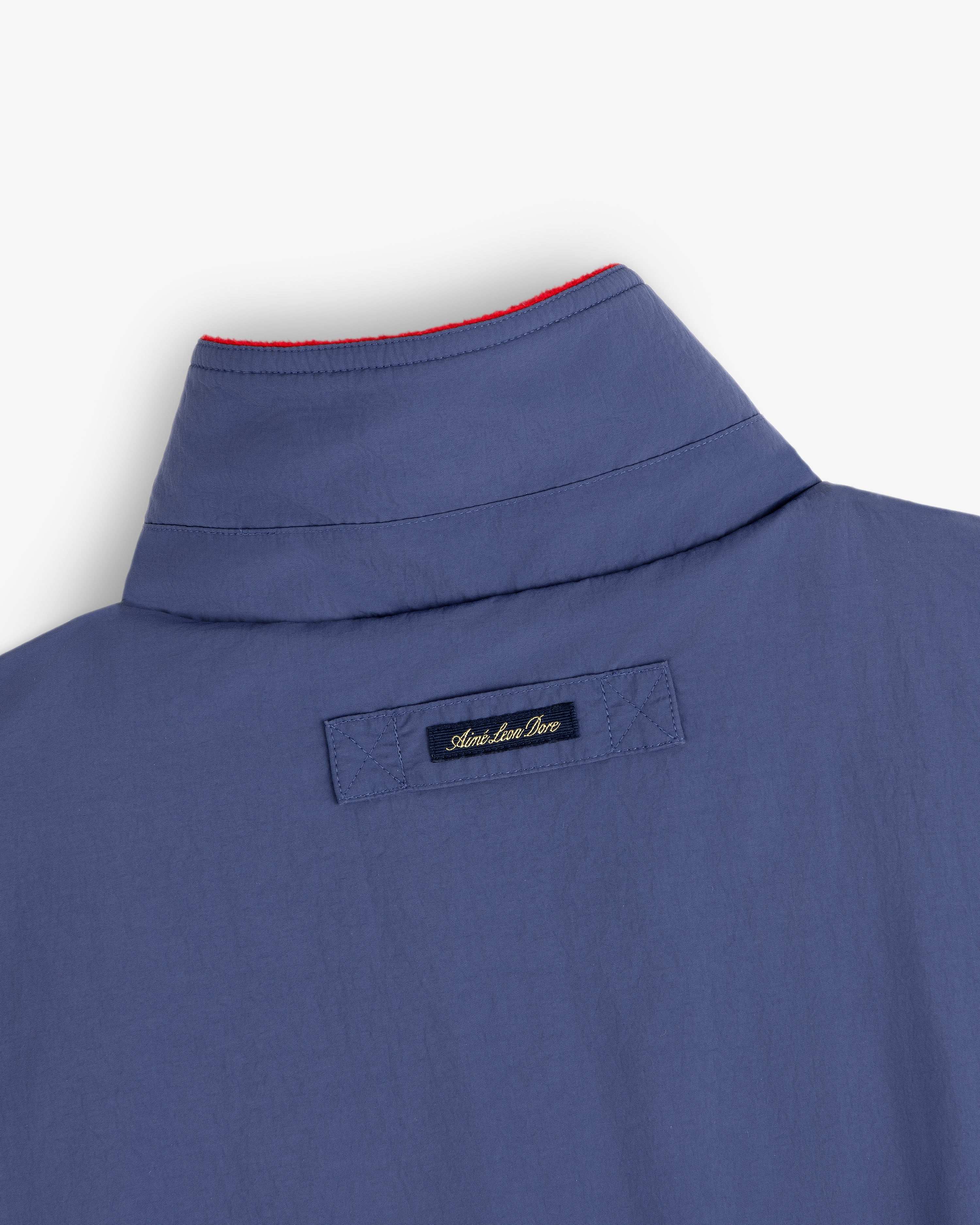 Fleece Lined Sport Windbreaker with black label and red stitching along the edge of the collar.