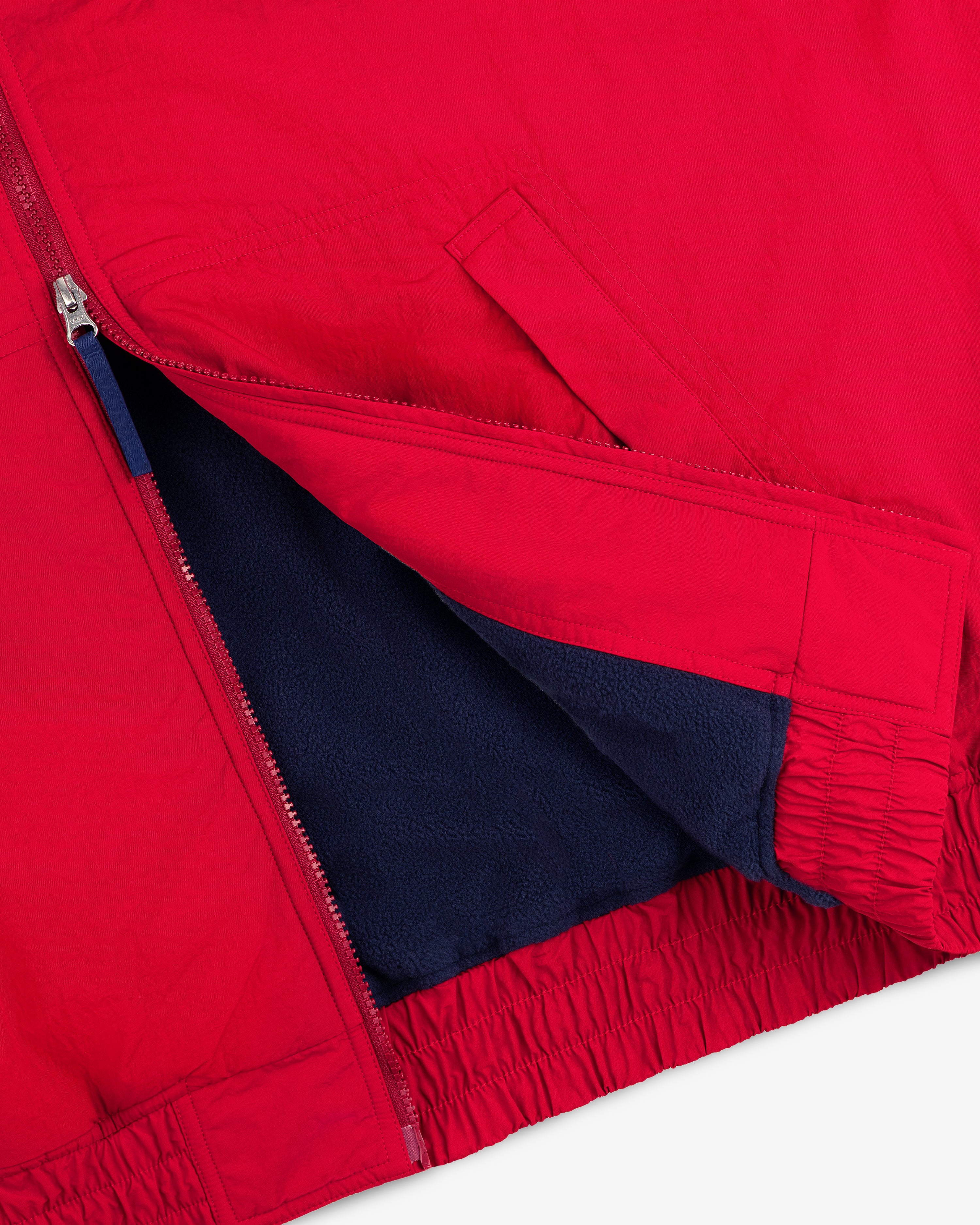 Fleece Lined Sport Windbreaker: Red, side pocket, silver zipper, elastic hem, dark blue fleece lining visible.