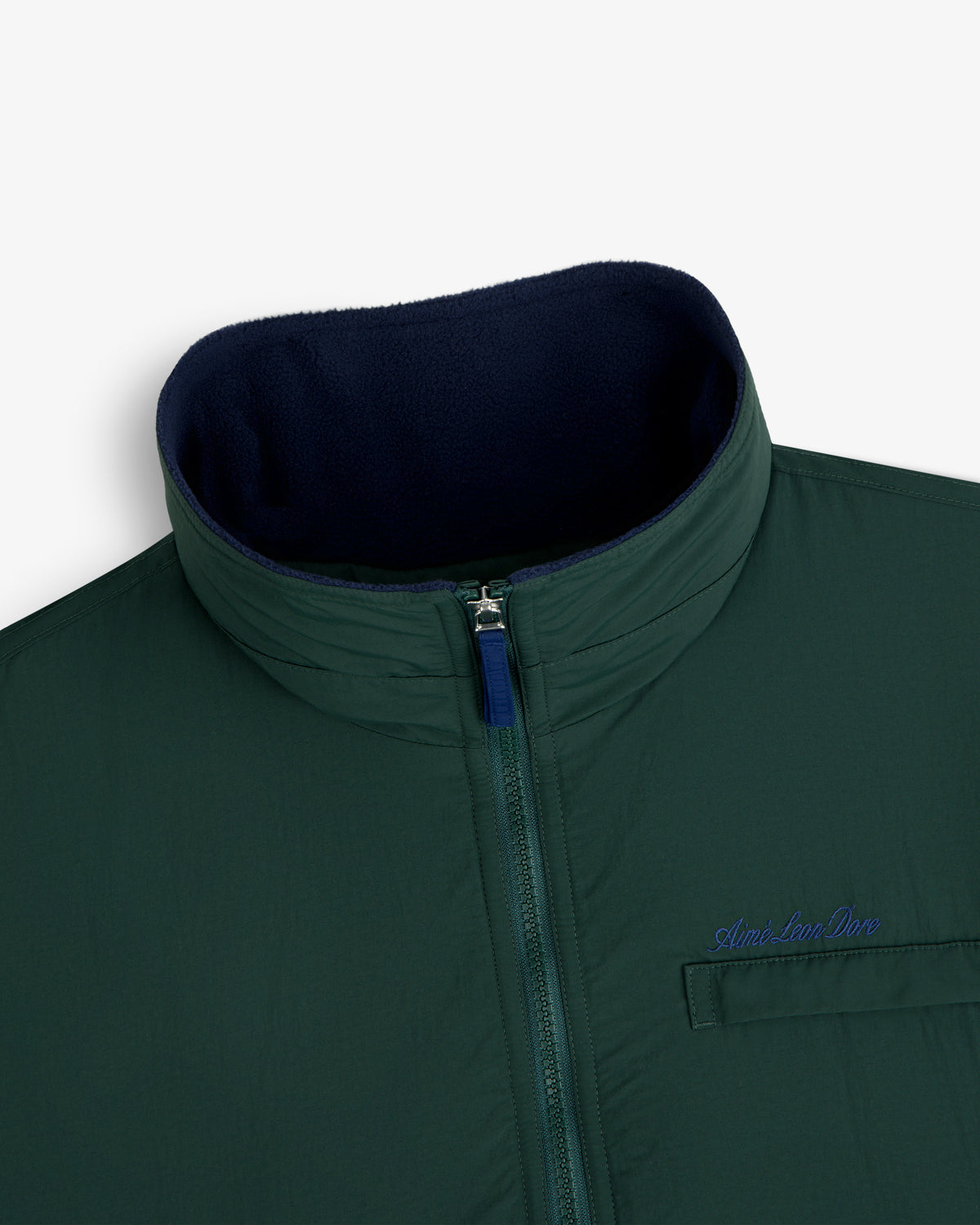 Fleece Lined Sport Windbreaker with green zip-up, high collar, chest pocket, and blue Aimé Leon Dore embroidery.
