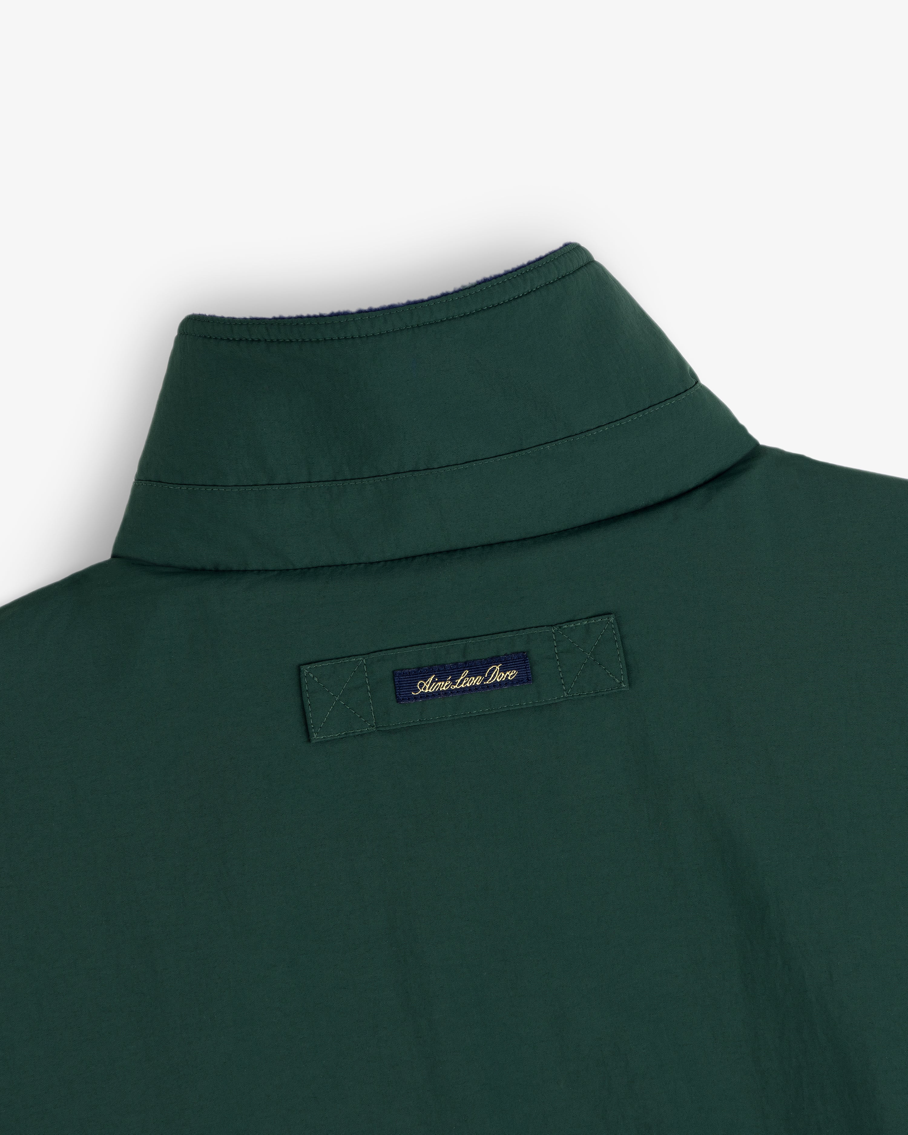 Back view of the Fleece Lined Sport Windbreaker, green, with a small navy “American Icon” label below the collar.