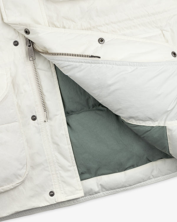 Close-up of an unzipped white Down-Filled Surplus Parka with a visible grey interior lining.