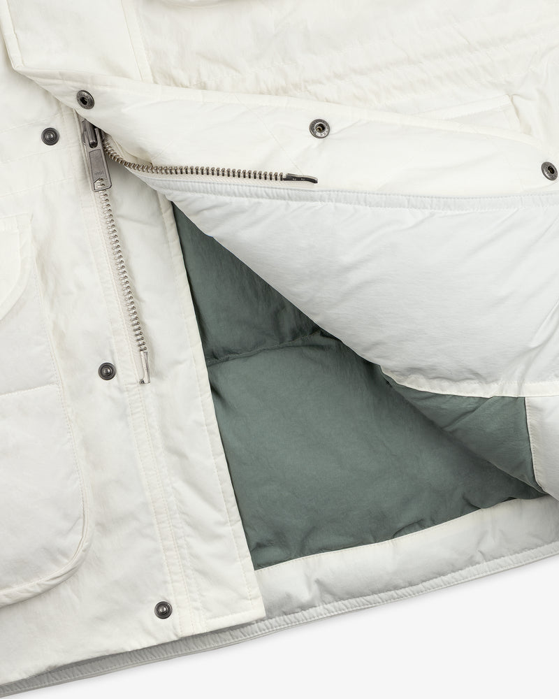 Close-up of an unzipped white Down-Filled Surplus Parka with a visible grey interior lining.