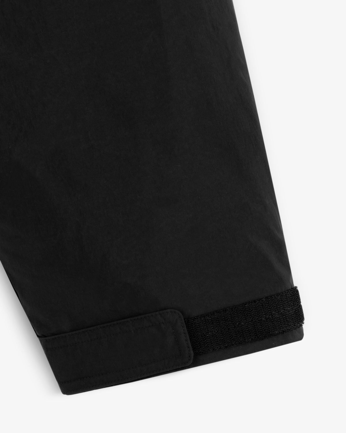 Black sleeve cuff with a velcro adjustable strap on the Down-Filled Surplus Parka.