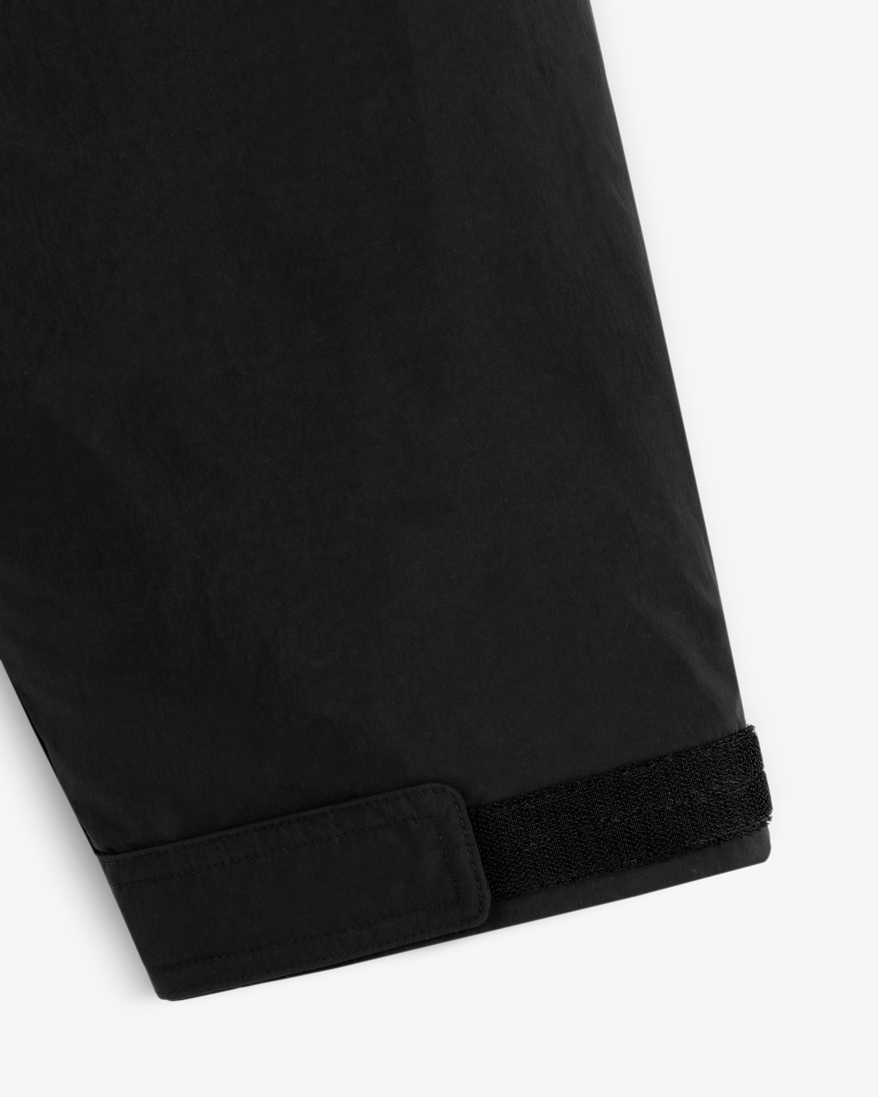 Black sleeve cuff with a velcro adjustable strap on the Down-Filled Surplus Parka.