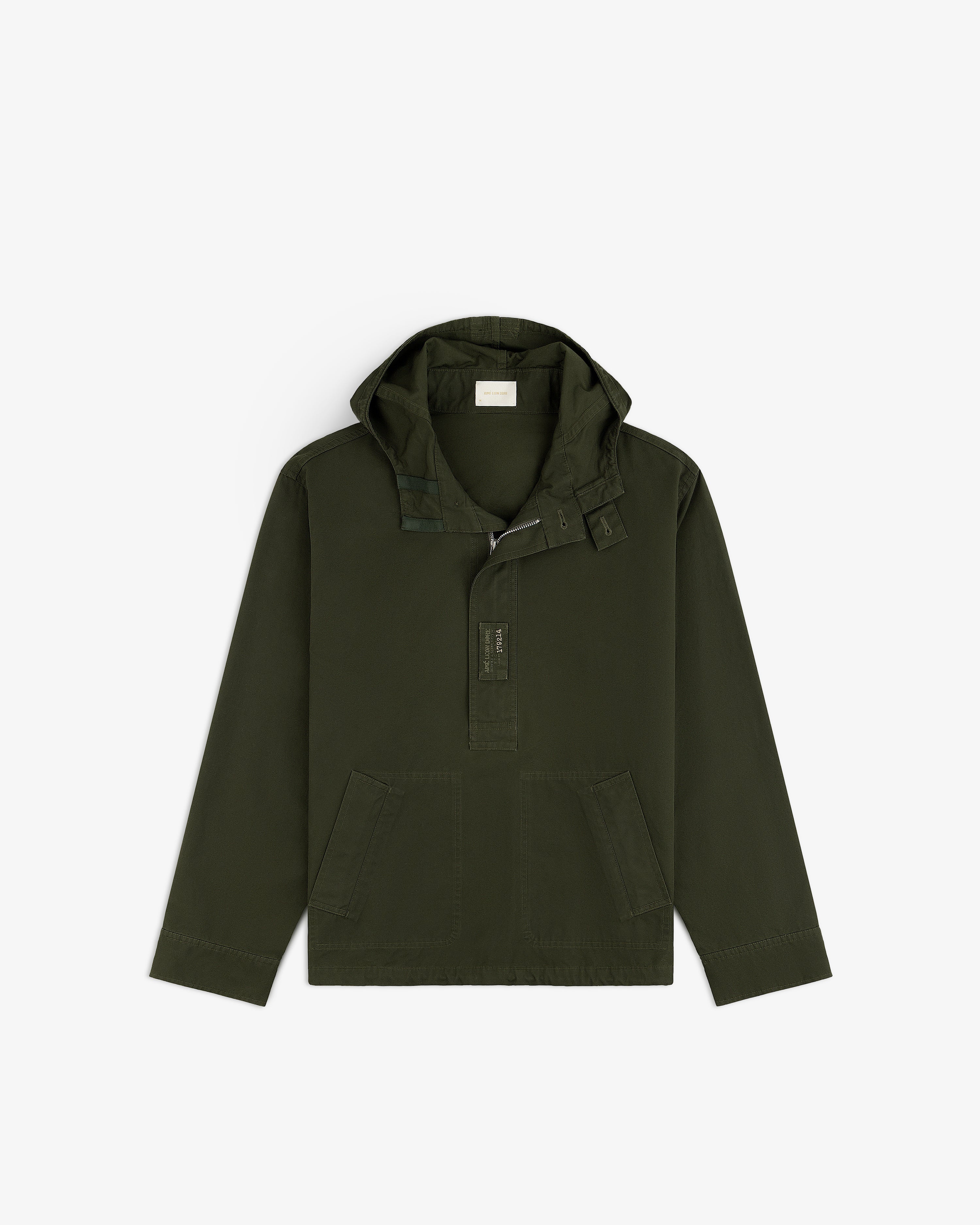 Garment Washed Anorak in olive green with a hooded half-zip closure and front patch pockets.