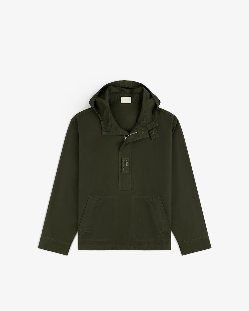 Garment Washed Anorak in olive green with a hooded half-zip closure and front patch pockets.