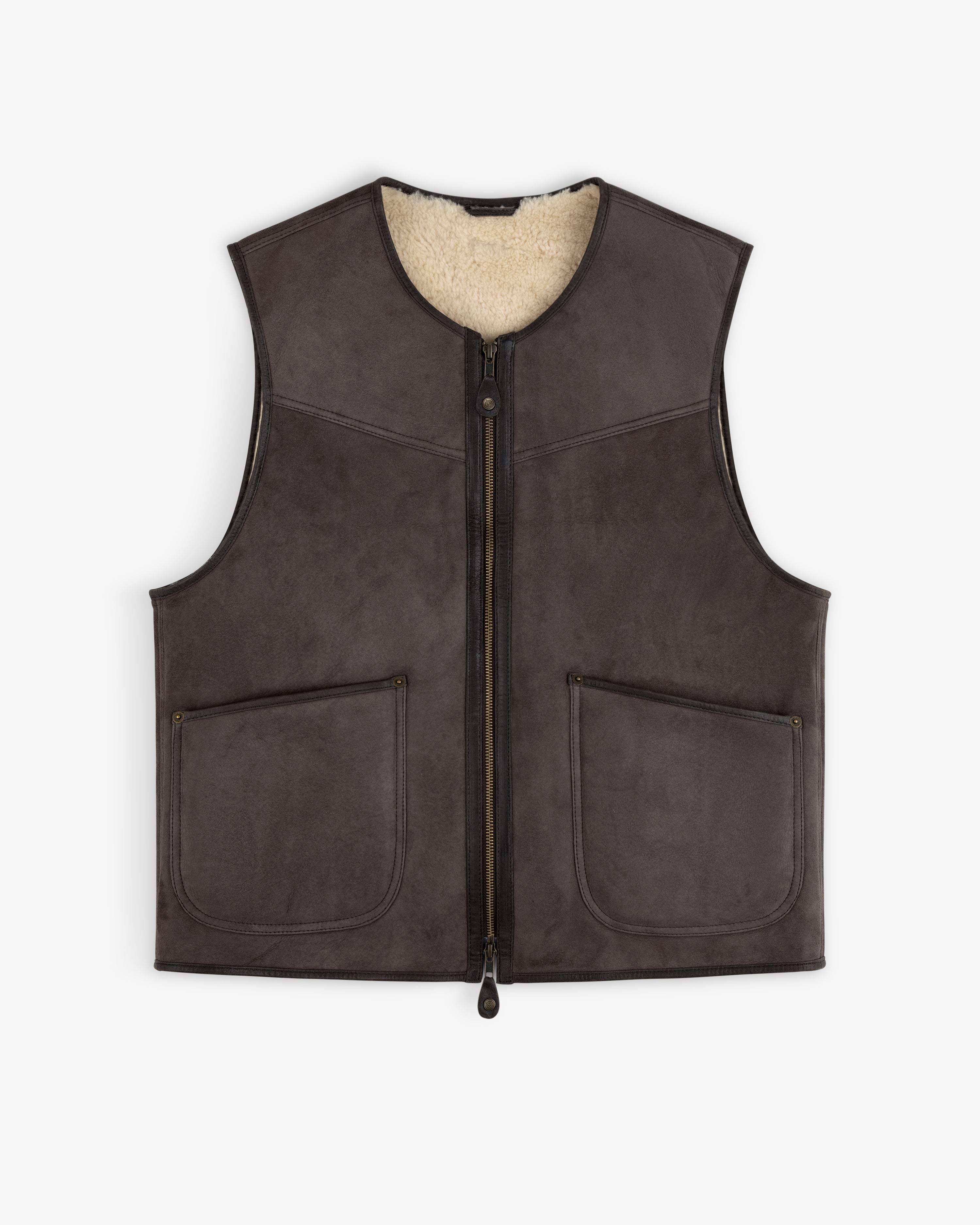 Shearling Biker Vest: dark brown sleeveless jacket with a cream-colored fuzzy lining and two front pockets.