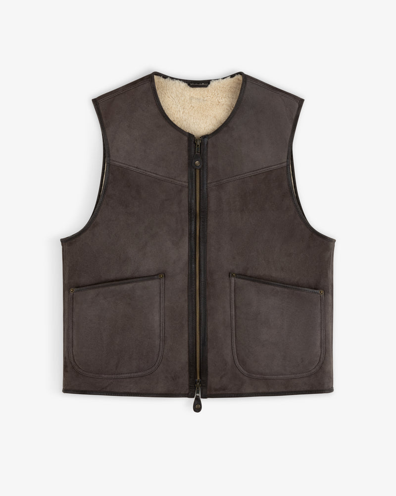Shearling Biker Vest: dark brown sleeveless jacket with a cream-colored fuzzy lining and two front pockets.