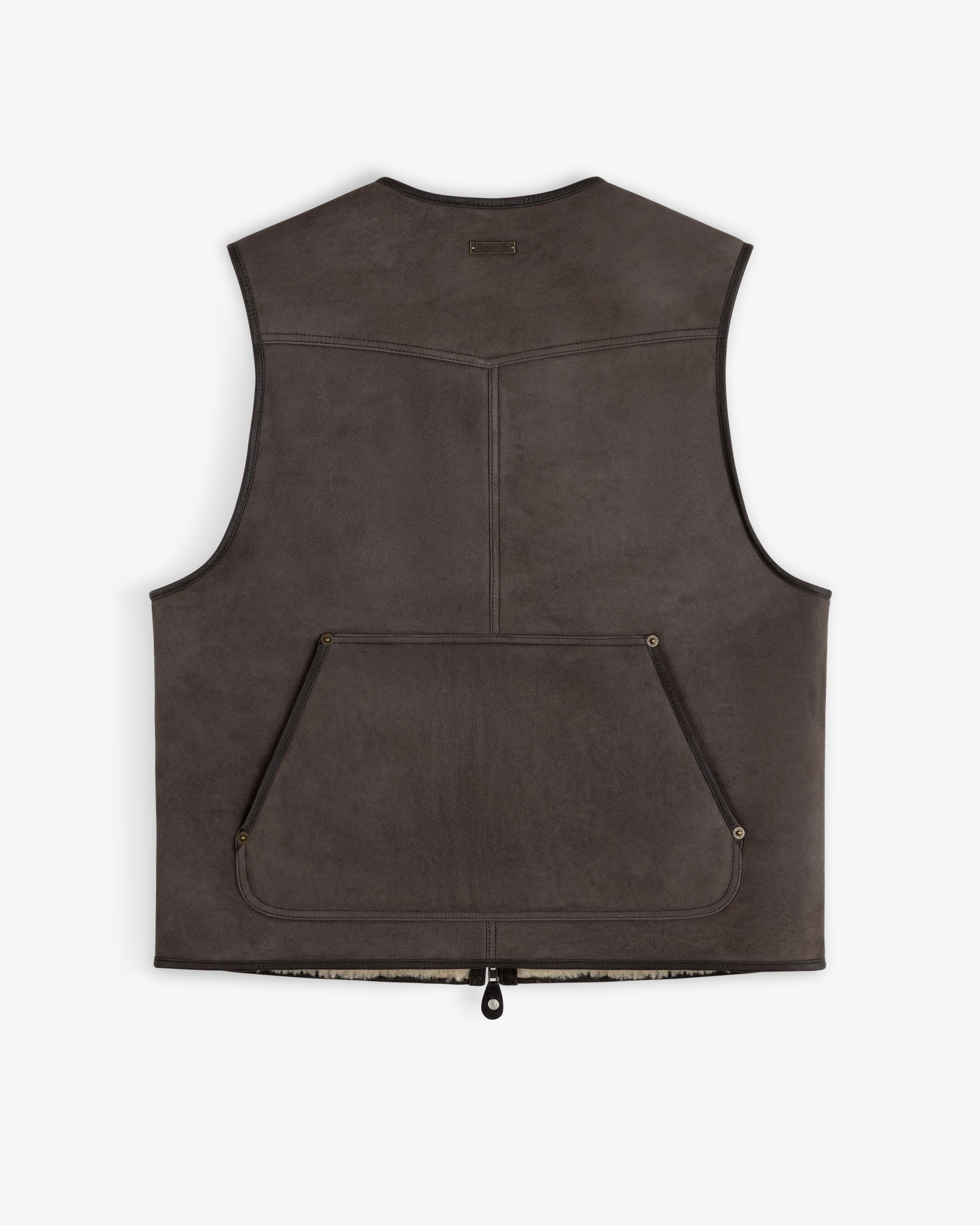 Back view of a dark brown Shearling Biker Vest with a large pocket and exposed shearling lining at the hem.