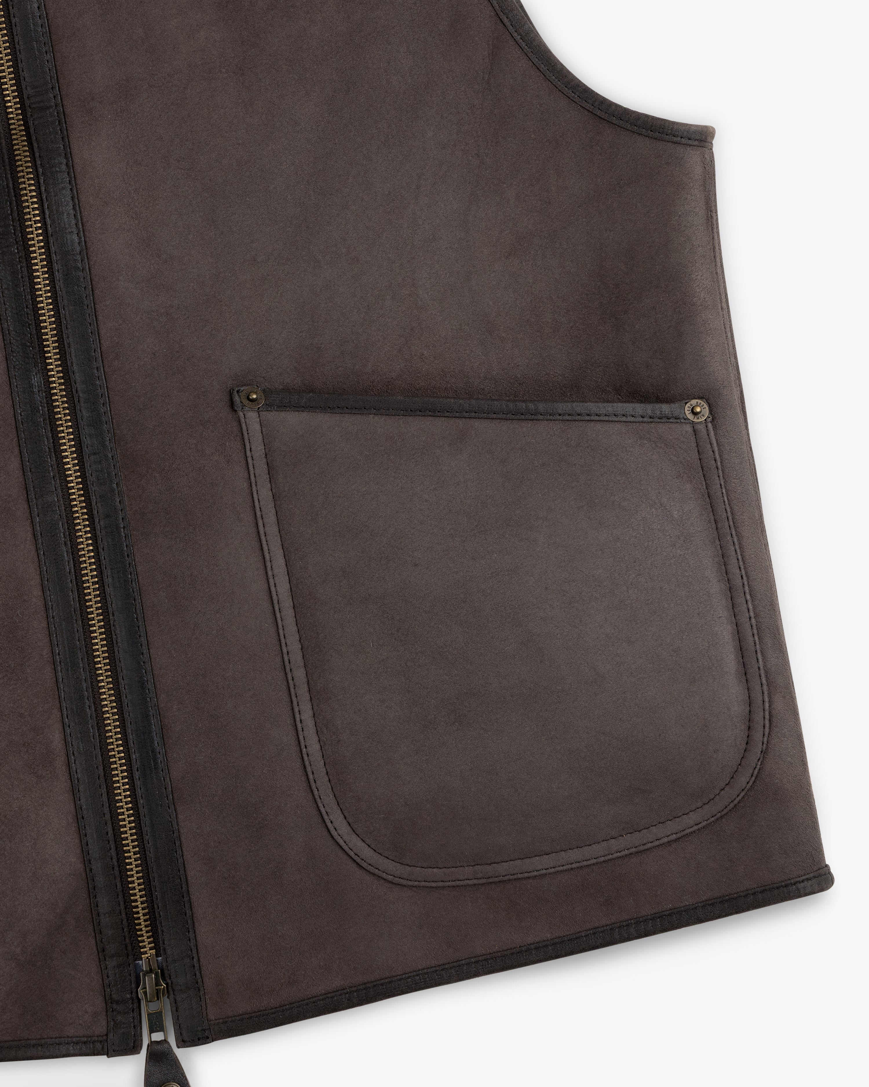 Dark brown Shearling Biker Vest with a zip-up front and a large pocket.