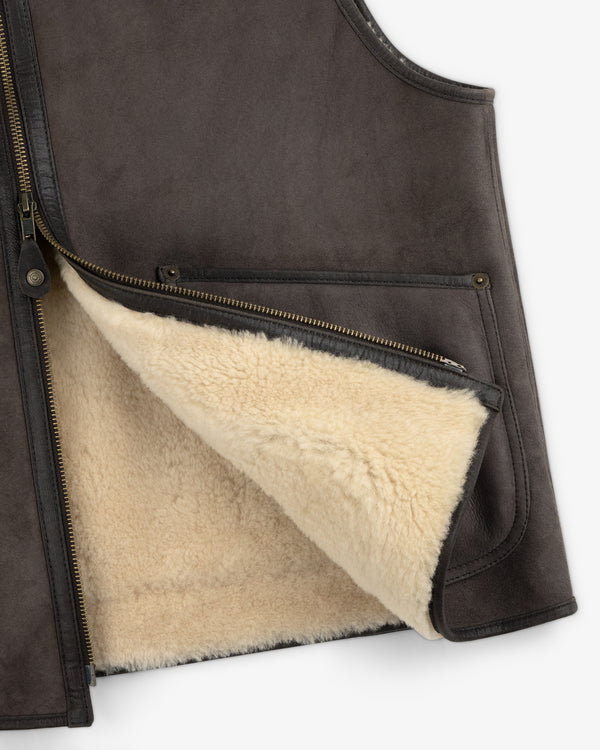 Dark brown Shearling Biker Vest with a cream-colored shearling lining and a metal front zipper.