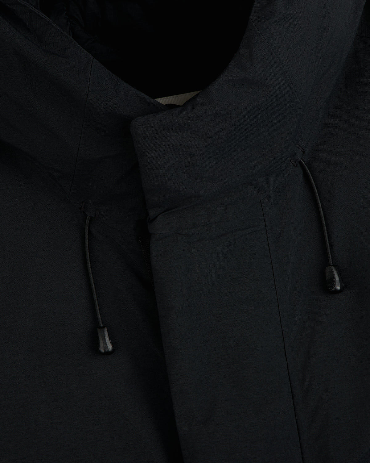 Close-up of the GORE-TEX Down Filled Fishtail Parka black collar with adjustable drawstrings.