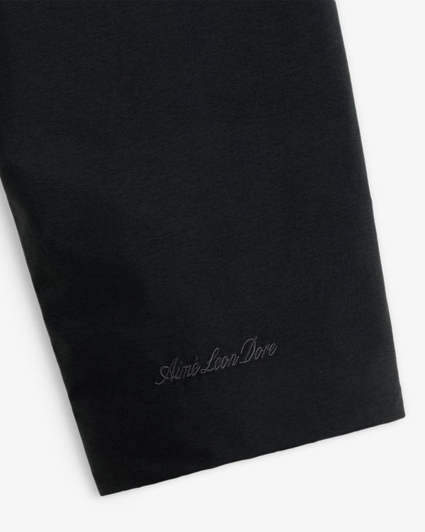 Close-up of a black GORE-TEX Down Filled Fishtail Parka sleeve featuring tonal brand embroidery at the cuff.