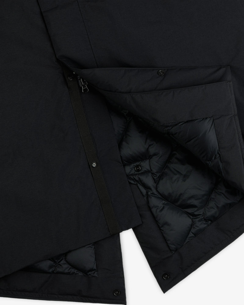 Black GORE-TEX Down Filled Fishtail Parka with a zipper, snap buttons, and a quilted interior lining.