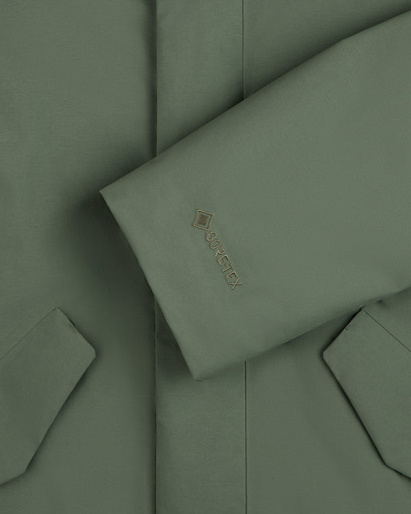 Olive green sleeve of the GORE-TEX Down Filled Fishtail Parka with a Gore-Tex logo on the cuff.