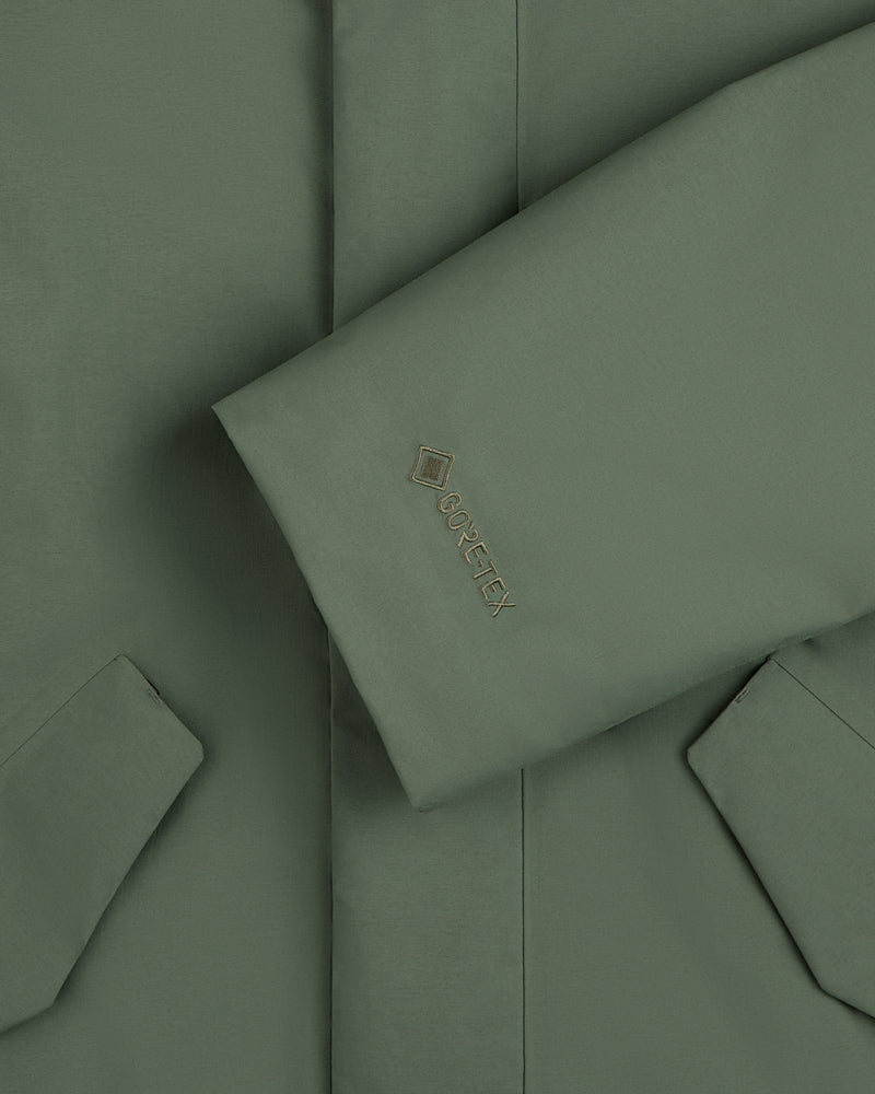 Olive green sleeve of the GORE-TEX Down Filled Fishtail Parka with a Gore-Tex logo on the cuff.
