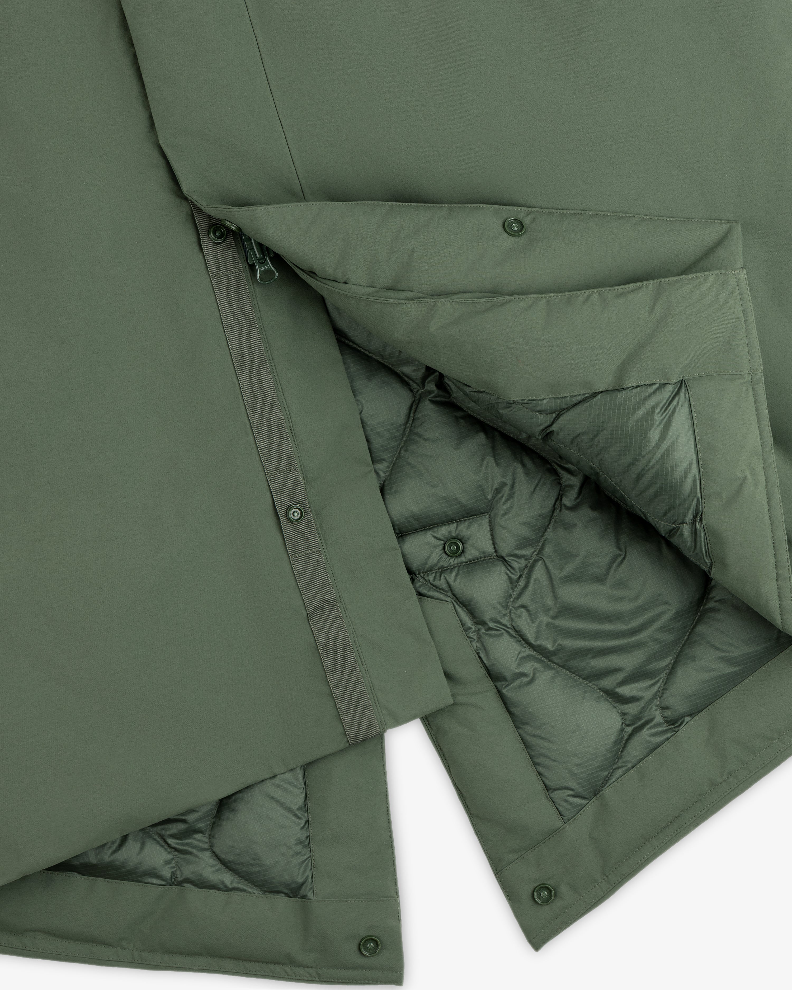 Olive green GORE-TEX Down Filled Fishtail Parka with a snap-button placket and a quilted interior lining.