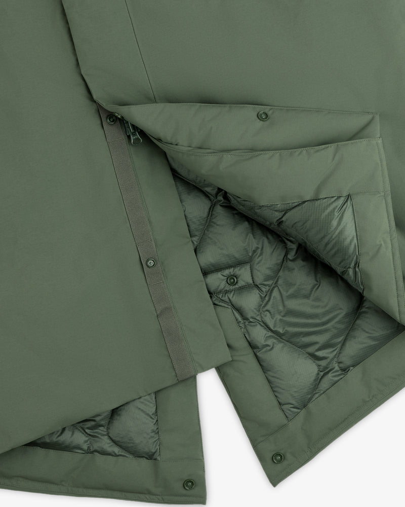 Olive green GORE-TEX Down Filled Fishtail Parka with a snap-button placket and a quilted interior lining.
