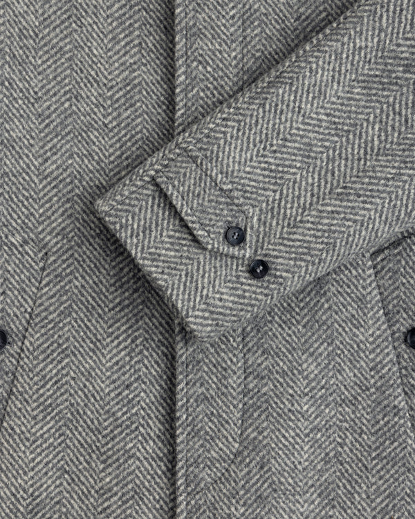Grey Wool Herringbone Overcoat sleeve featuring two buttons on the cuff.