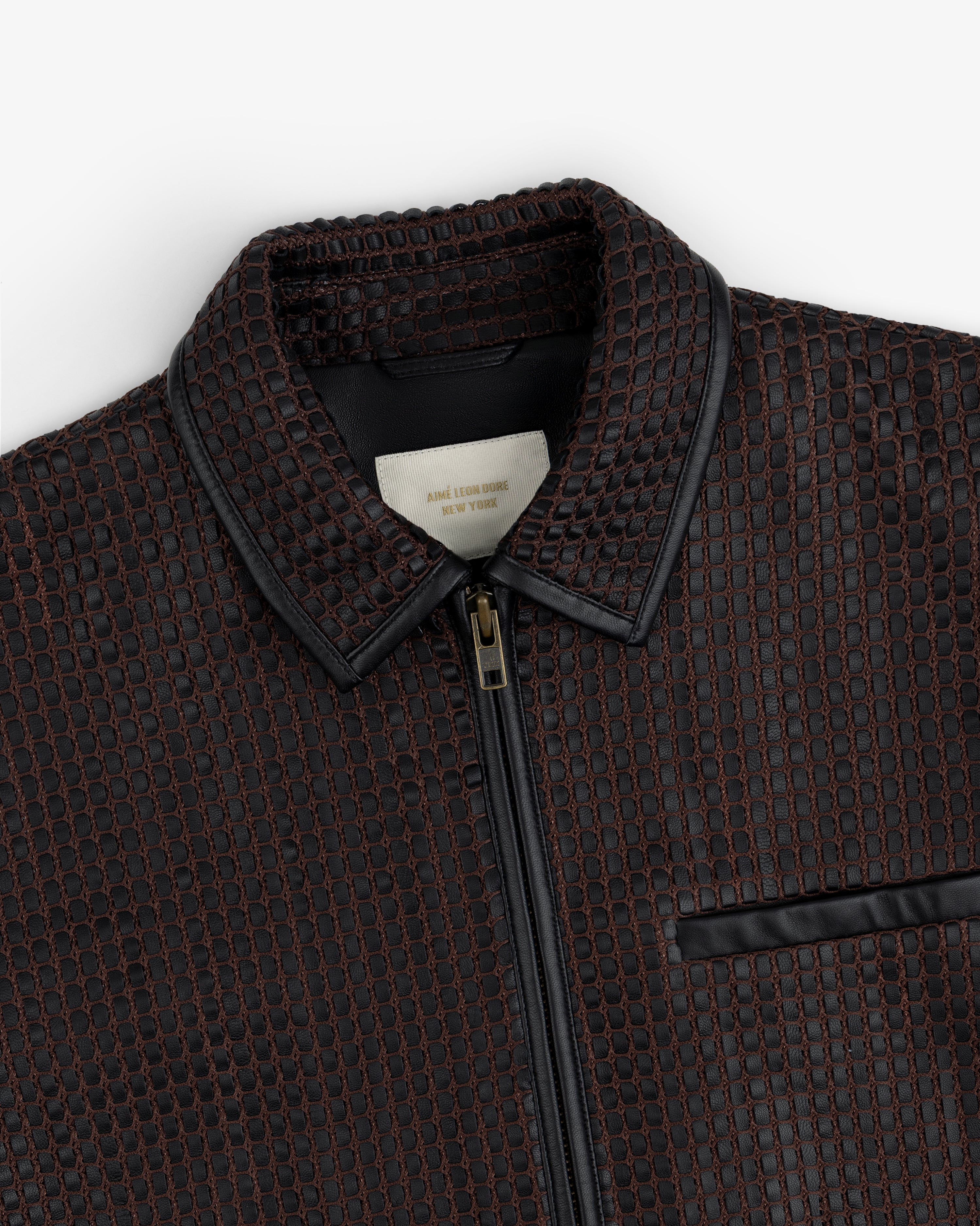 Woven Leather Jacket in a black and brown grid pattern with a zippered front and a leather collar.