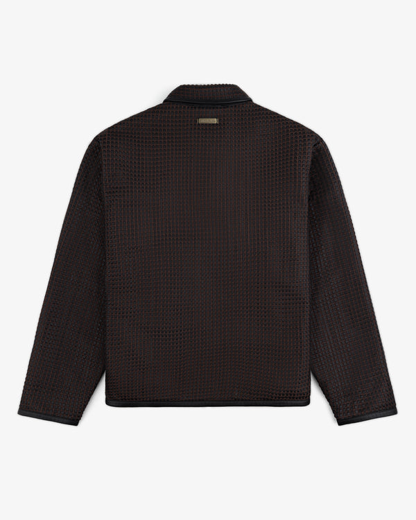 Back view of a Woven Leather Jacket with a dark, textured grid pattern and a metal brand tag at the collar.