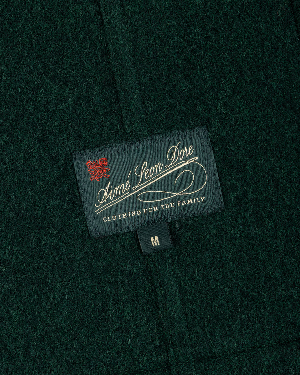 Dark green Wool Sport Coat featuring a black Aimé Leon Dore tag and a size M label.