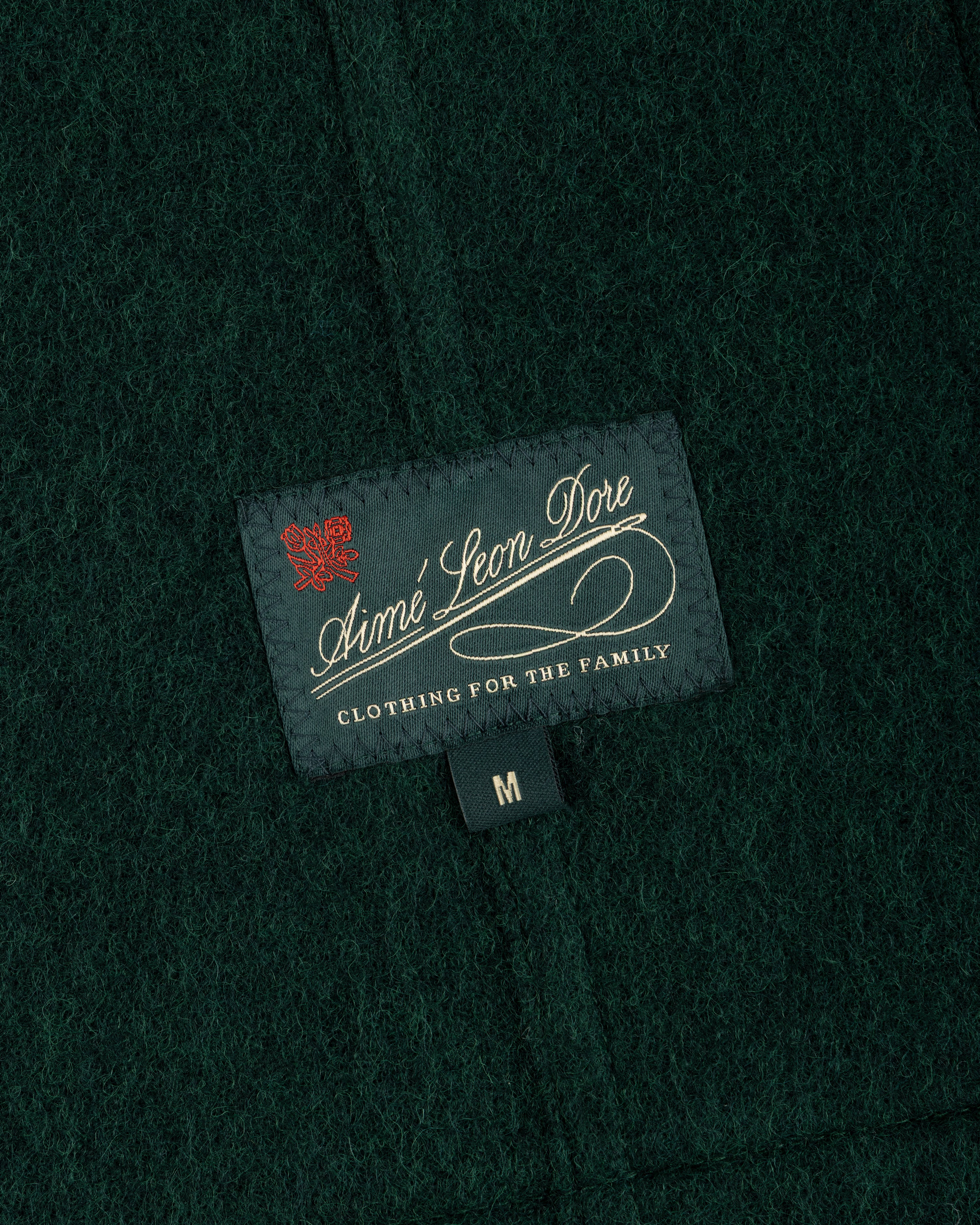 Dark green Wool Sport Coat featuring a black Aimé Leon Dore tag and a size M label.