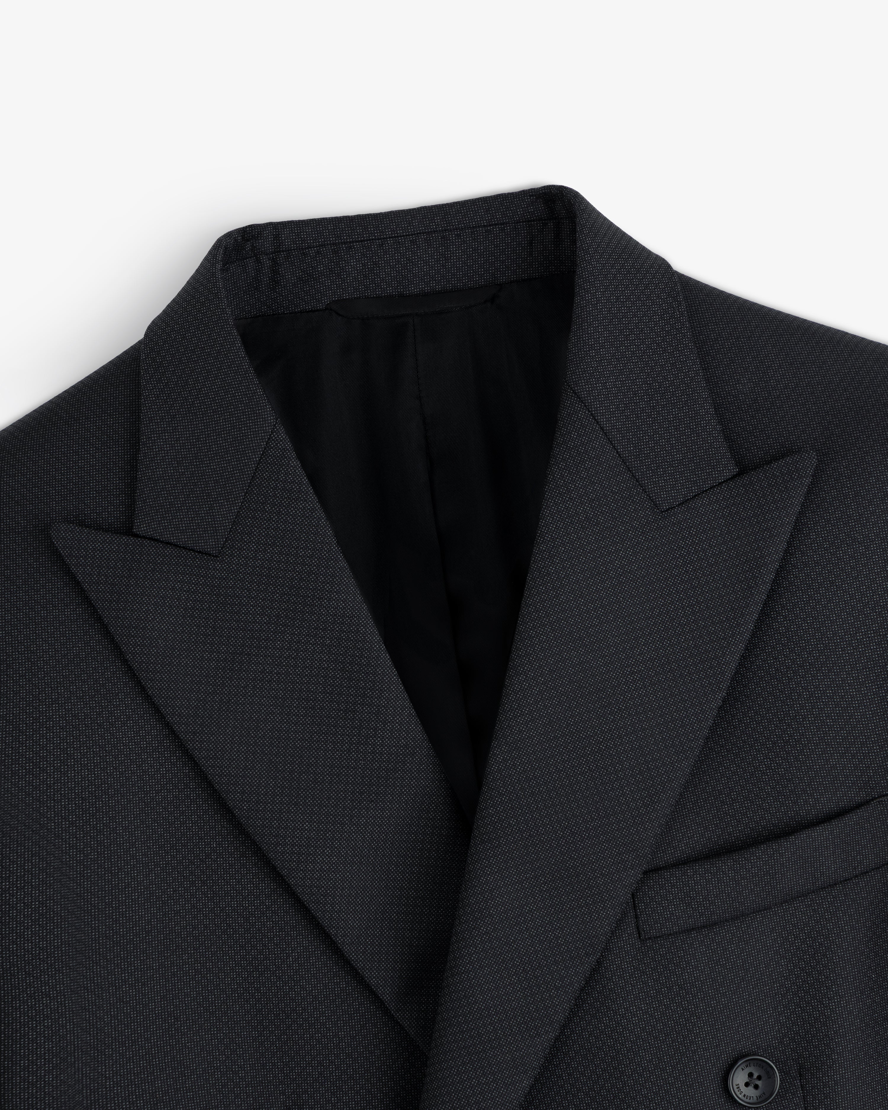 Close-up of a dark grey Double-Breasted Wool Jacquard Suit Jacket with peaked lapels.
