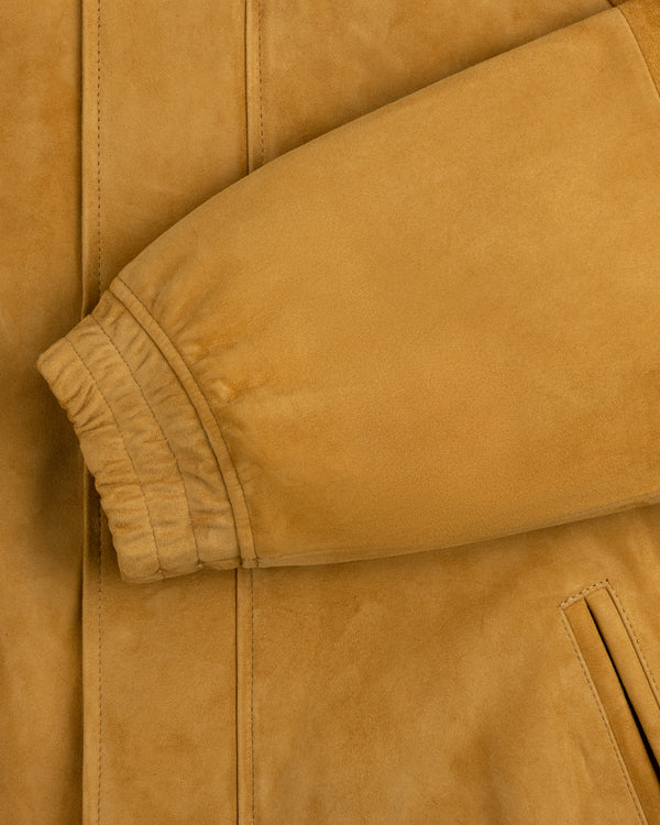 Close-up of Suede Cafe Racer Jacket’s tan sleeve with ribbed cuff and slanted pocket detail.