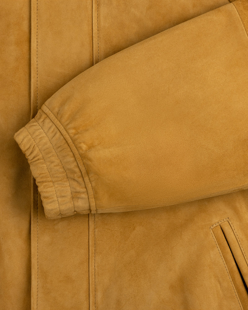 Close-up of Suede Cafe Racer Jacket’s tan sleeve with ribbed cuff and slanted pocket detail.