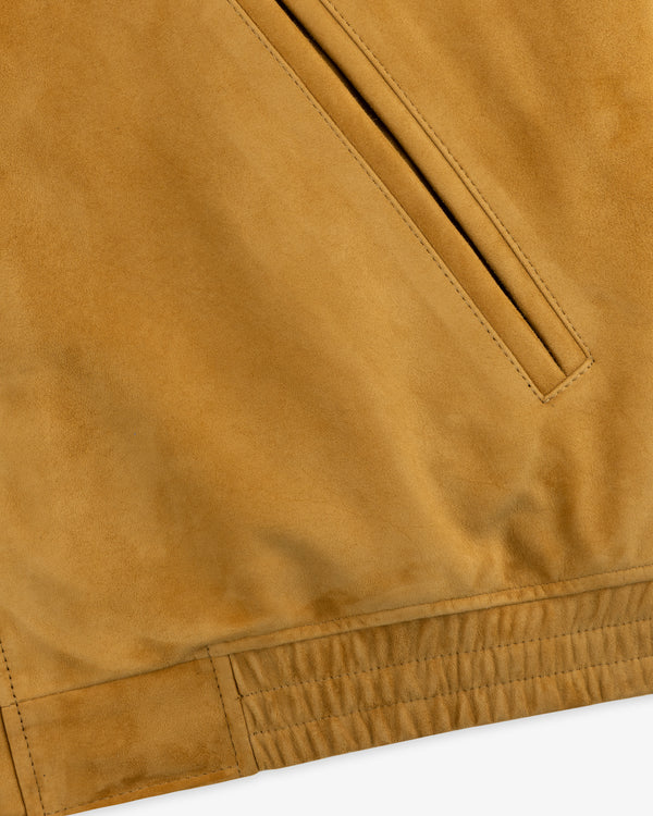 Close-up of Suede Cafe Racer Jacket pocket showing visible stitching and elasticated hem.