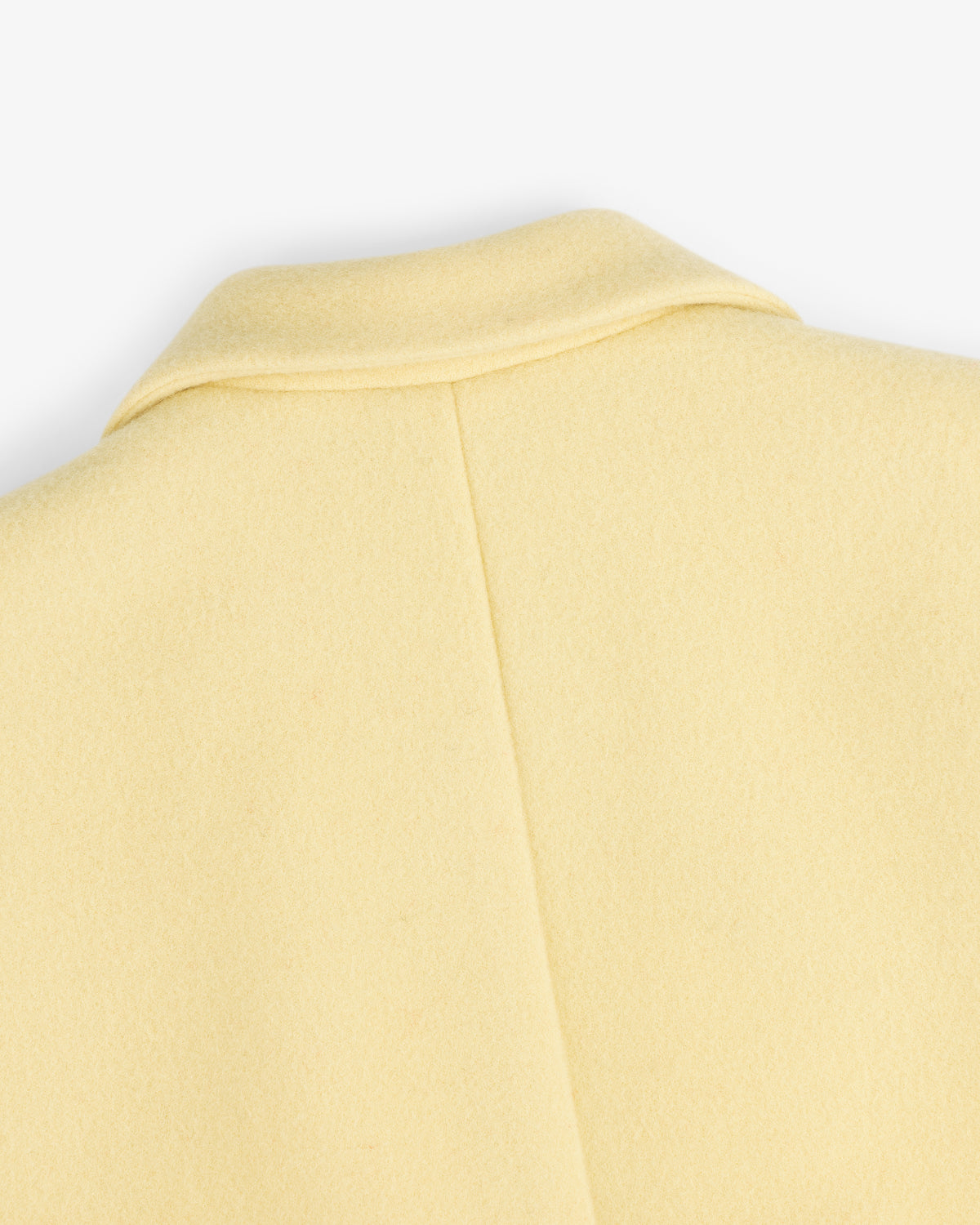 Close-up of the collar and back seam of a pale yellow Wool Sportcoat.