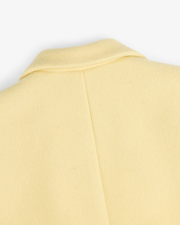 Close-up of the collar and back seam of a pale yellow Wool Sportcoat.