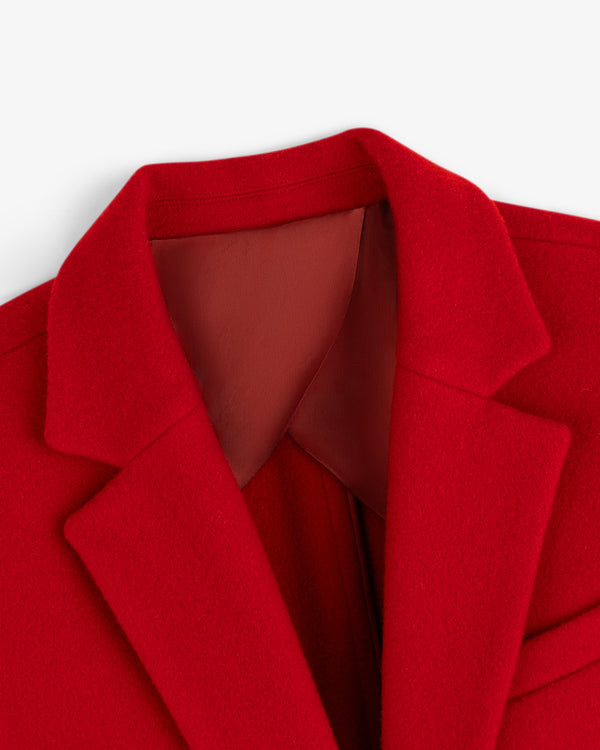 Close-up of a bright red Wool Sportcoat with a notched lapel.