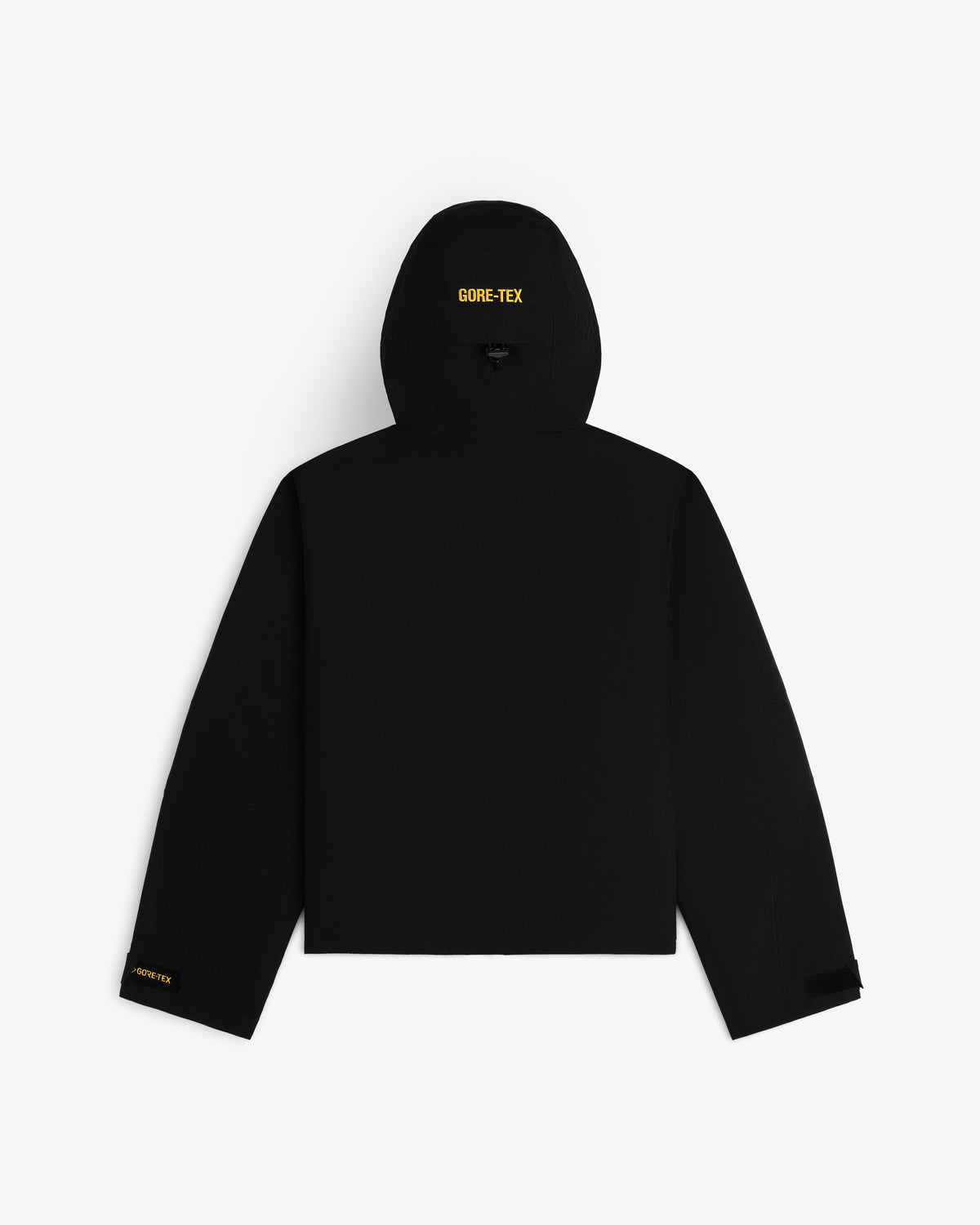 Back view of a black Cropped GORE-TEX Shell Jacket with yellow GORE-TEX logos on the hood and sleeve.