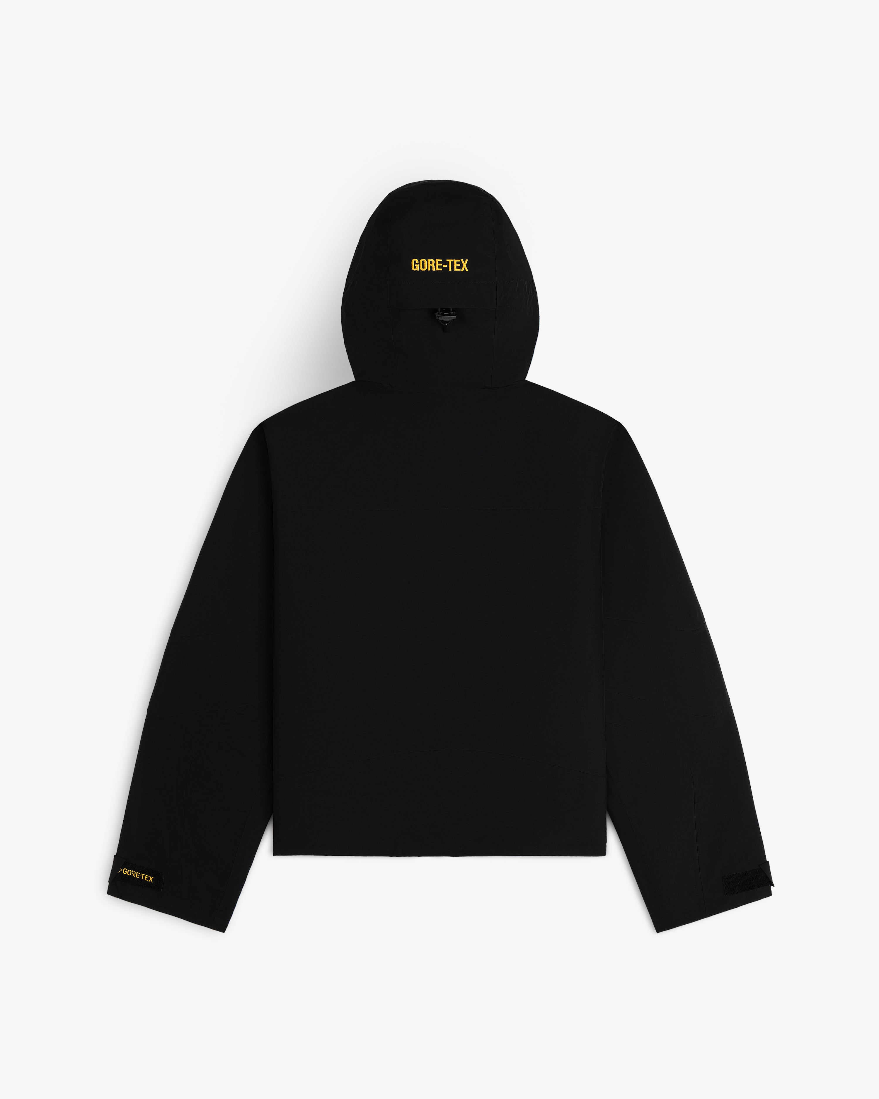 Back view of a black Cropped GORE-TEX Shell Jacket with yellow GORE-TEX logos on the hood and sleeve.