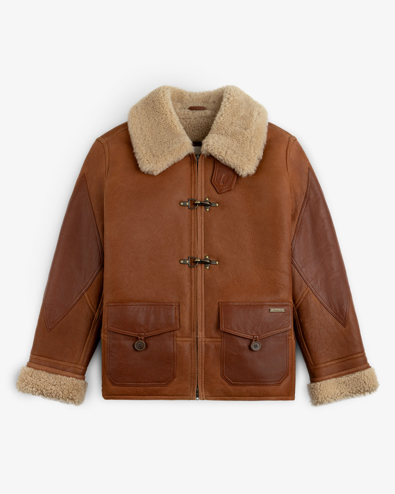 Shearling Bomber Jacket in brown leather with a tan shearling collar, cuffs, two metal toggles, and buttoned flap pockets.