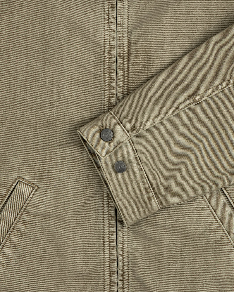 Olive green sleeve of a Flocked Denim Jacket featuring a buttoned cuff.