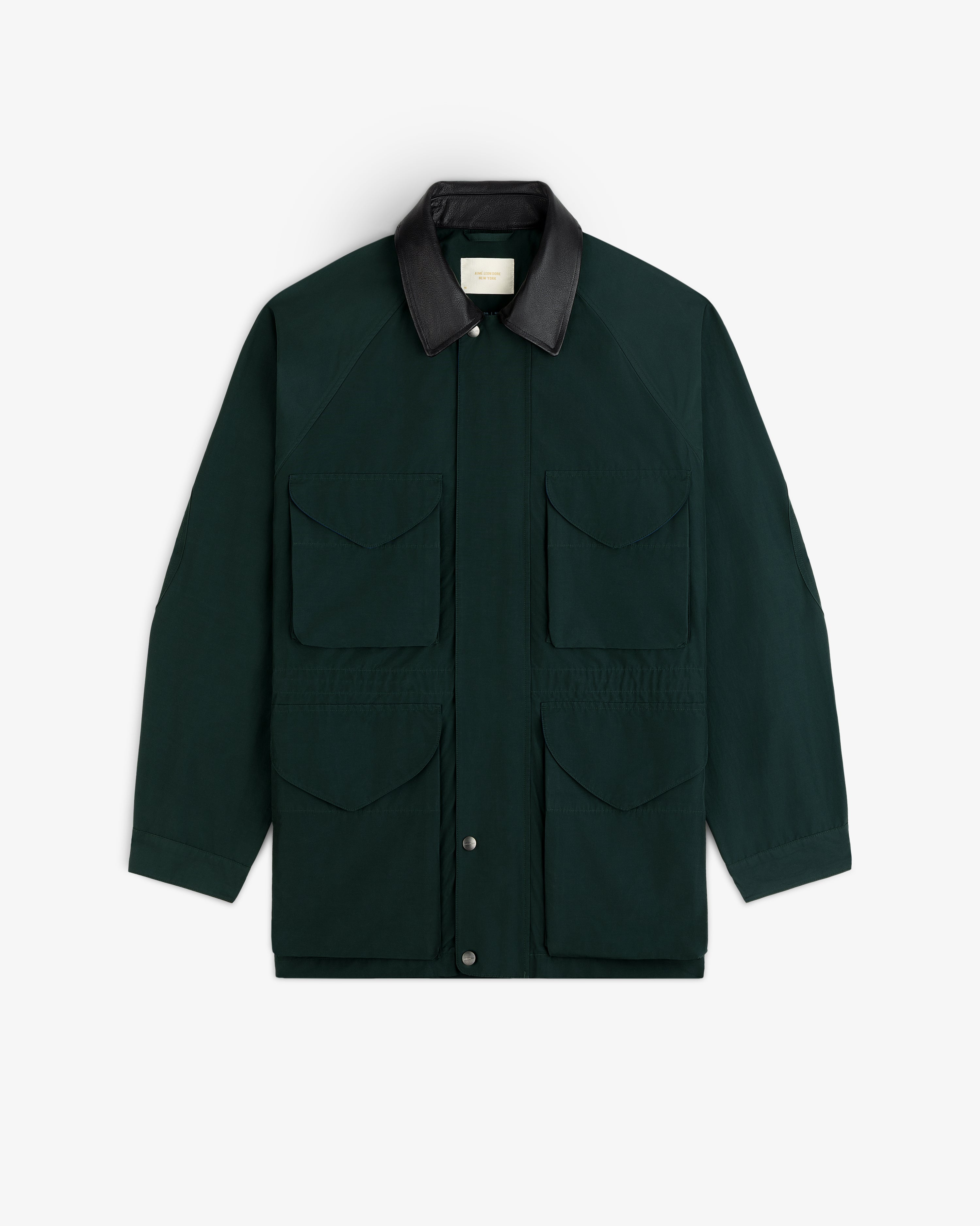 Lightweight Barn Jacket in dark green with four front pockets and black collar, shown flat on white background.