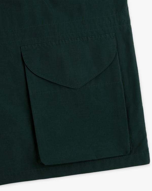 Close-up of dark green Lightweight Barn Jacket featuring a large sewn-on flap pocket.