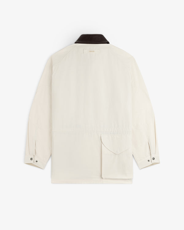 Lightweight Barn Jacket in white with black collar, buttoned cuffs, and lower back pocket, shown from the rear.