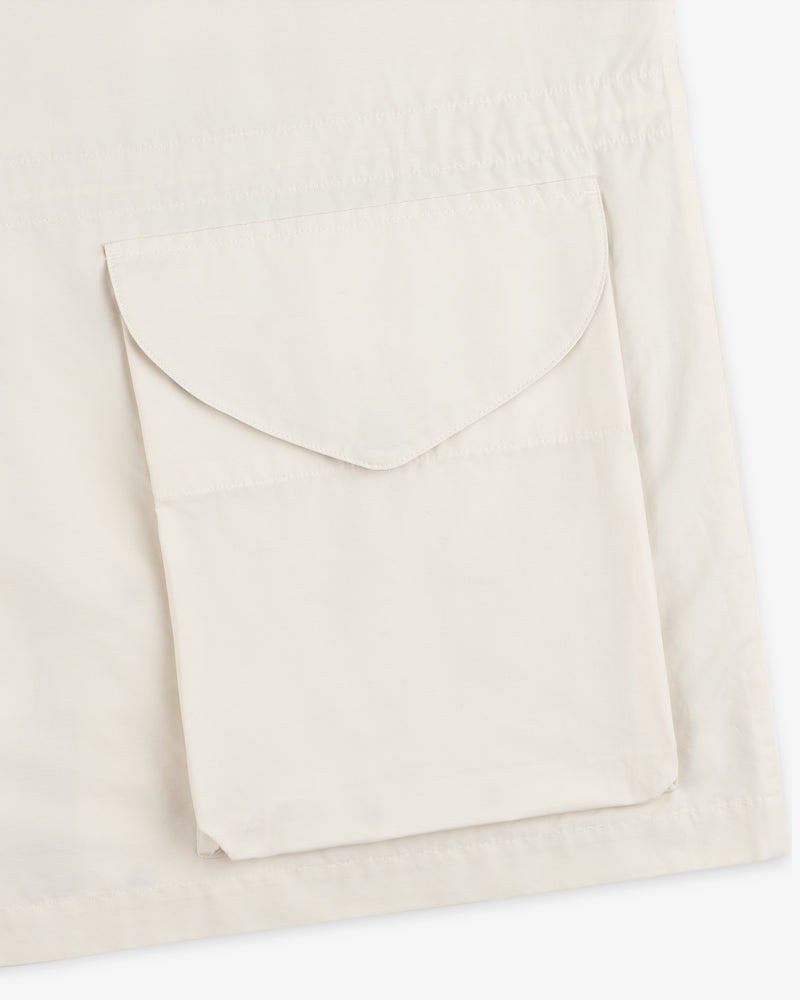 Close-up of a beige Lightweight Barn Jacket with a flap pocket on the front.