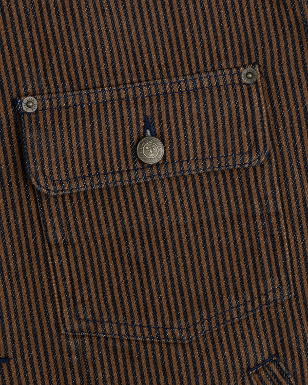 Hickory Stripe Denim Trucker Jacket with brown and navy stripes, pocket, and metal buttons on the garment.