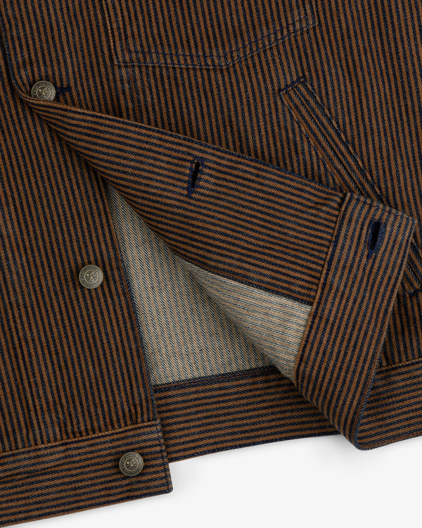 Hickory Stripe Denim Trucker Jacket with brown and navy stripes, shown partially open to display its inner lining.