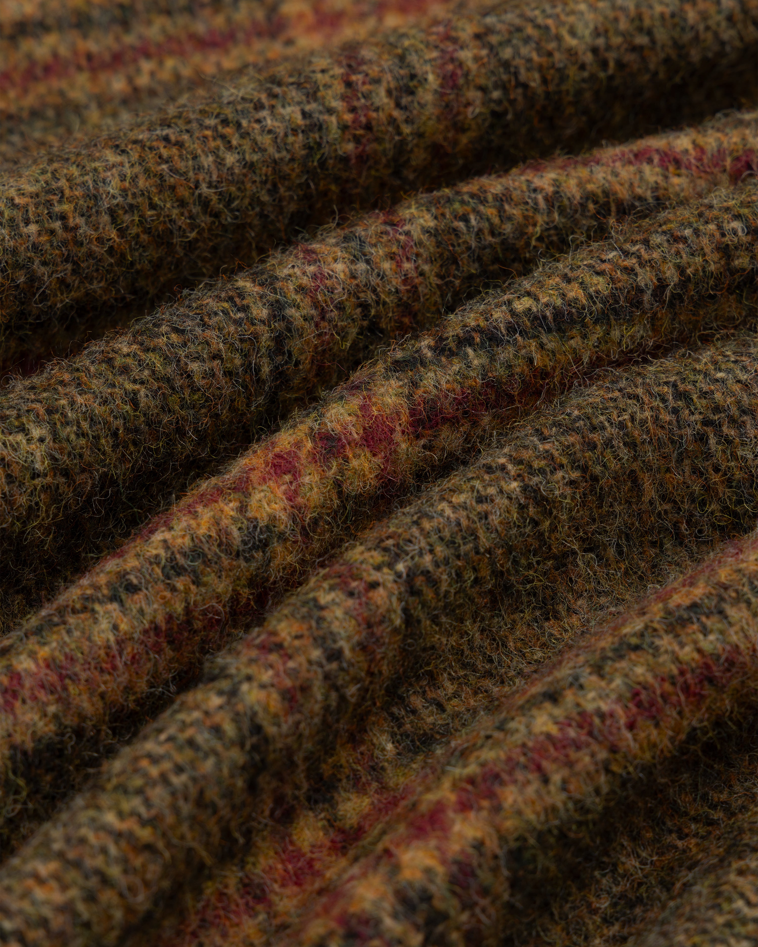 Close-up of the brown and red plaid tweed fabric on a Single-Breasted Plaid Tweed Suit Jacket with a textured surface.