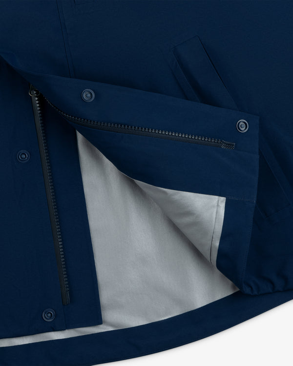Close-up of Yankees GORE-TEX Rain Delay Jacket with open zipper, snap buttons, and light gray inner lining.