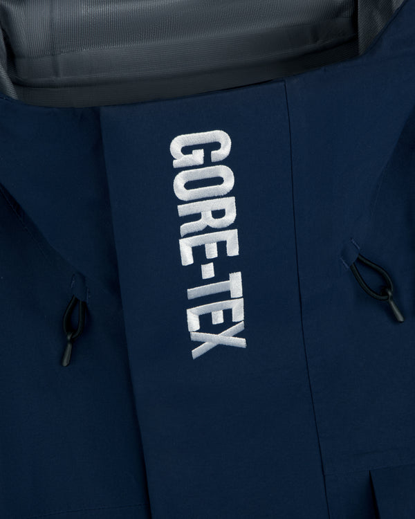 Close-up of Yankees GORE-TEX Rain Delay Jacket in navy with white GORE-TEX embroidery on the front.