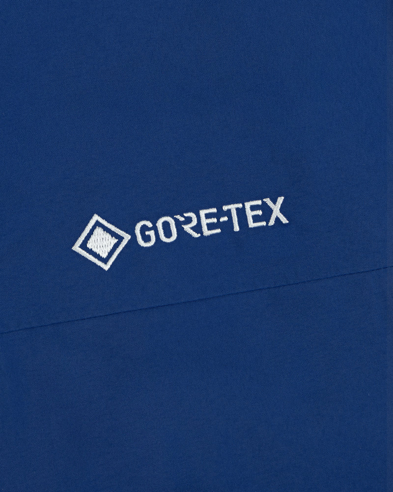 Close-up of the Dodgers GORE-TEX Rain Delay Jacket with a white GORE-TEX logo embroidered on blue fabric.